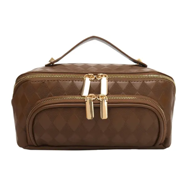 Zoom sur la fermeture éclair premium et la poignée de transport ergonomique de la trousse matelassée