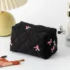 Face arrière de la trousse de toilette en coton avec imprimé floral à carreaux
