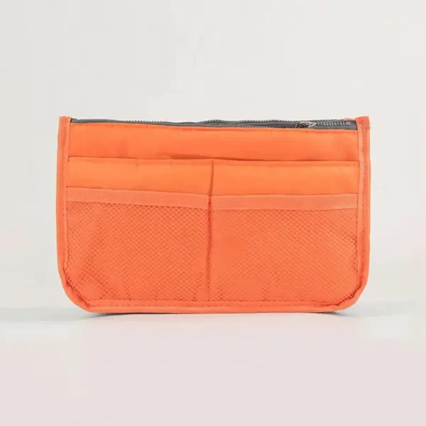 Vue intérieure montrant les nombreux compartiments et poches de rangement de la trousse multipoches