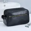 Trousse de toilette en cuir noir avec fermeture zippée