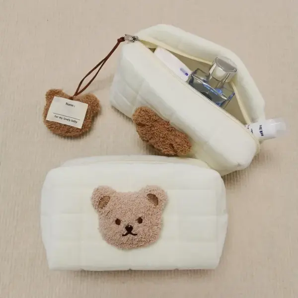 Trousse de toilette pour bébé en polyester avec motif ourson rose, fermeture éclair et forme cylindrique